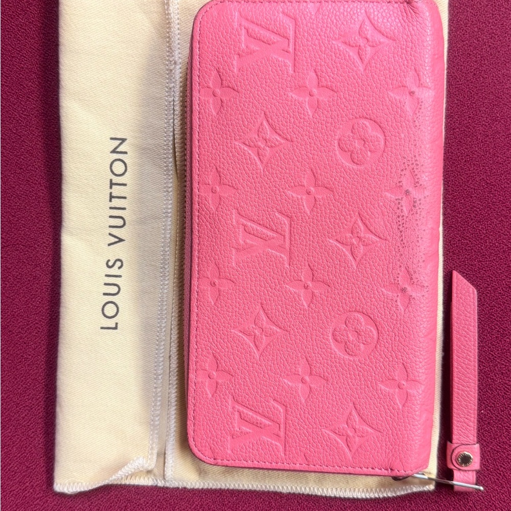 Authenticated Louis Vuitton Pink/Coral Monogram Empreinte Zippy Leather Wallet - Picture 2 of 16